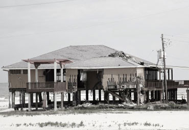 wind damage - spray foam can help prevent uplift to Spring Lake roofs